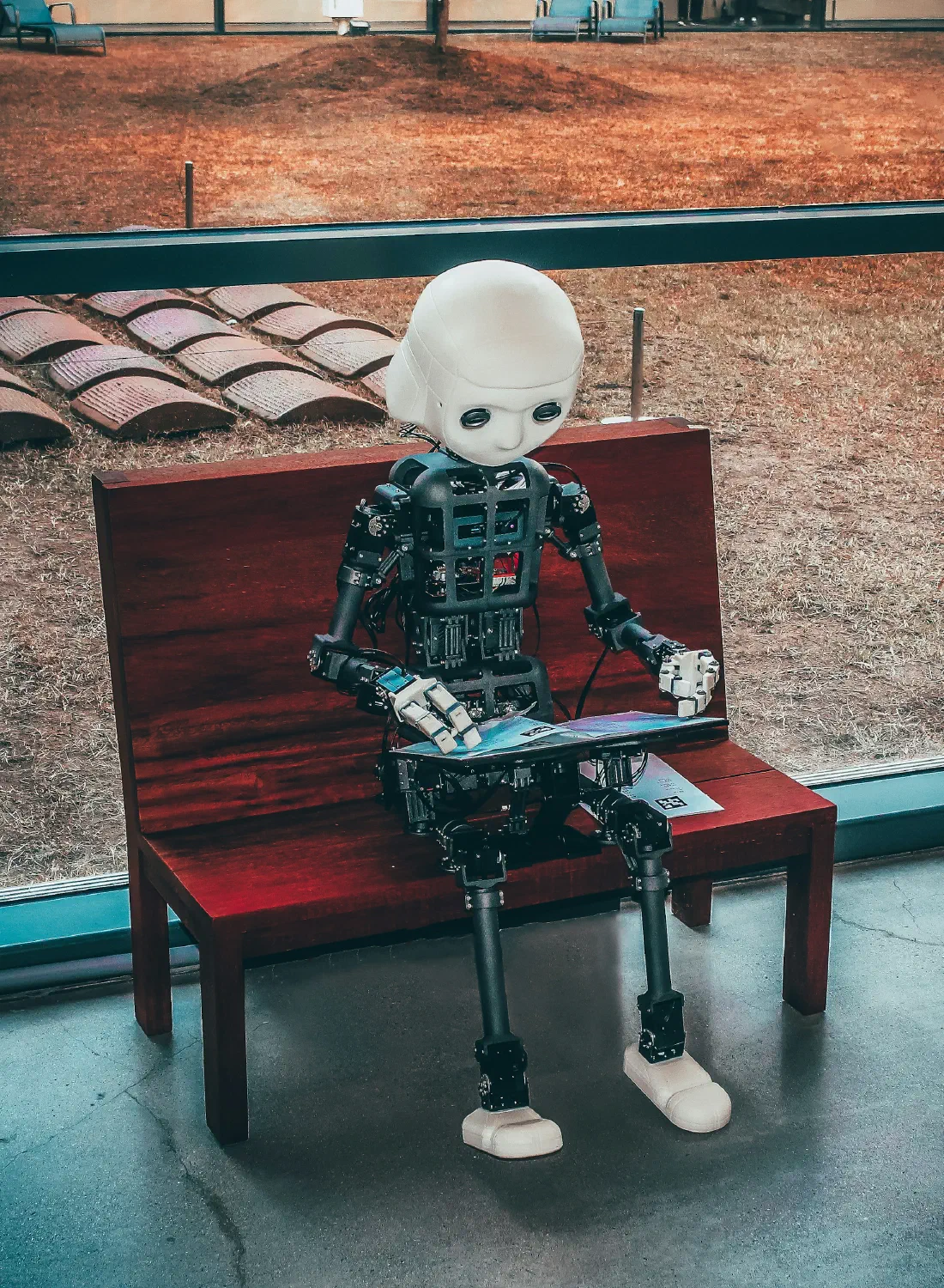 A humanoid robot reading — AI assistants now answer customers' questions directly
