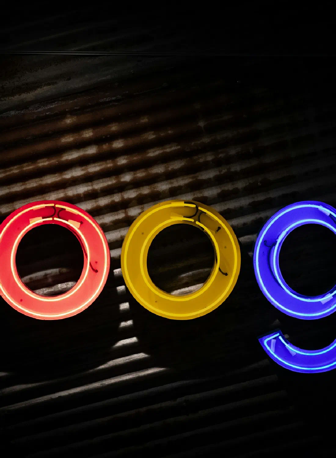 A glowing Google sign in neon — the search box where your customers start